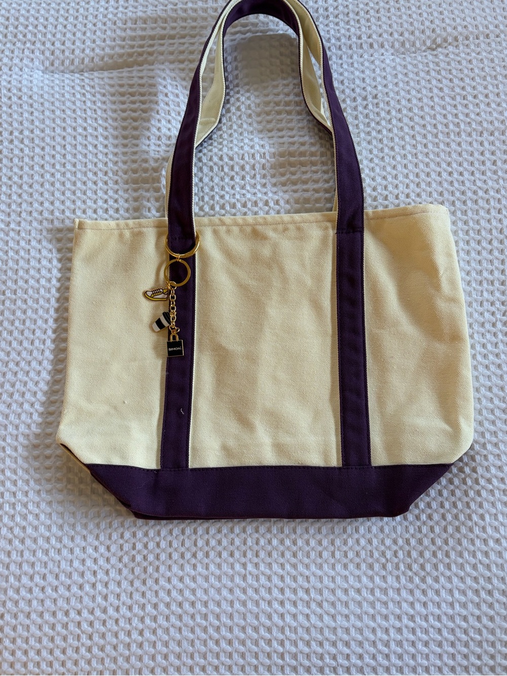 Cream Canvas Tote Bag with Dark Purple Trim and Gold Charm
